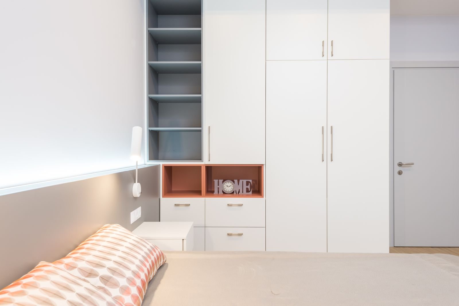 White fitted wardrobe with open shelving and drawers in a Manchester bedroom — ARM Builds